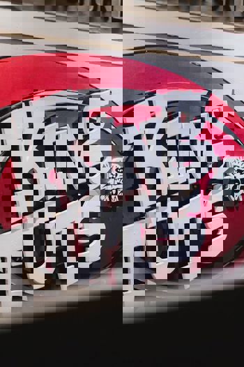 A close-up shot of the King Tut's Wah Wah Hut logo, a vibrant red and white sign for the famous Glasgow live music venue.