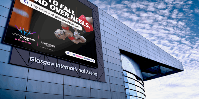  Gemini said A digital billboard on the Glasgow International Arena advertises the 2026 Commonwealth Games. It features a gymnast mid-flip with the slogan "Time to fall head over heels."
