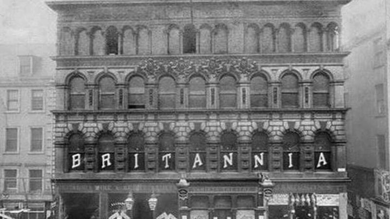 An old black and white photo of the Britannia Panopticon in Glasgow, a historic music hall, with the word "BRITANNIA" visible in large letters across the front.