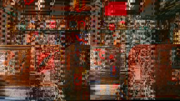 Interior of a Japanese-style bar with eclectic decor.