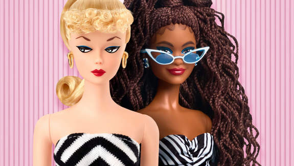 Two close-up Barbie dolls in matching black-and-white striped tops. The doll on the right wears stylish white-framed sunglasses.