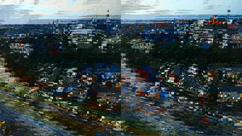 Aerial view of a large crowd gathered for a concert in Galvanizers Yard at the SWG3 complex in Glasgow.