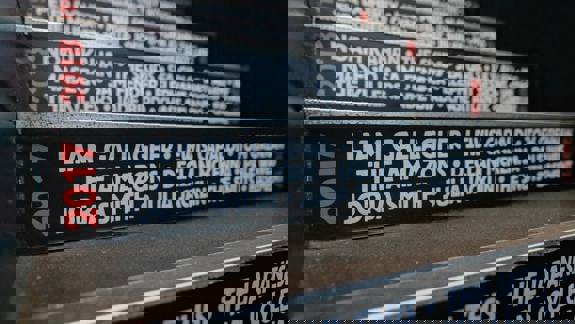 A close-up view of a staircase with the names of musicians who performed there, including Liam Gallagher and Lewis Capaldi.