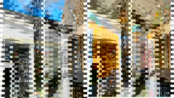 A two-part image showing the exterior of the Timorous Beasties shop and a view of its ornate interior.